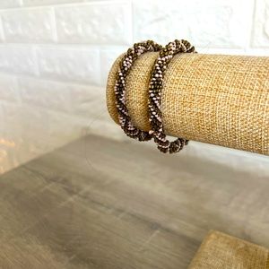 Pair of pink and gold bead bracelets